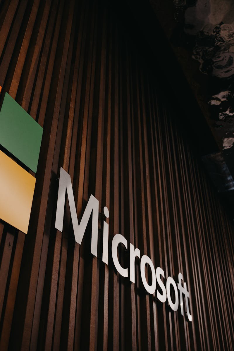 Interior view of Microsoft office with logo on wooden wall in Brussels, Belgium.